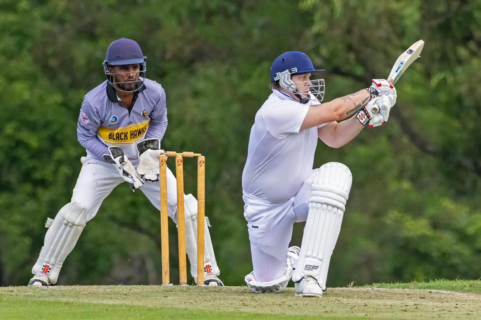Cricket action with a Blackhawks wicketkeeper